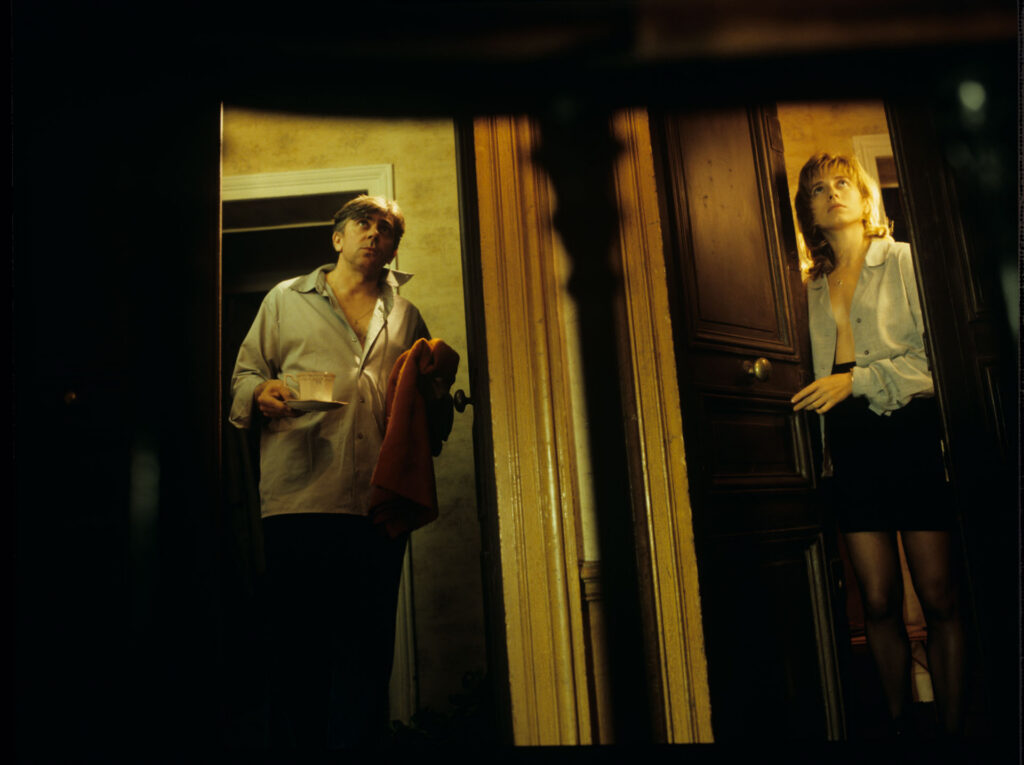 Lucille (Charlotte Very) and her neighbor are scheduled to meet at Lucille's apartment.