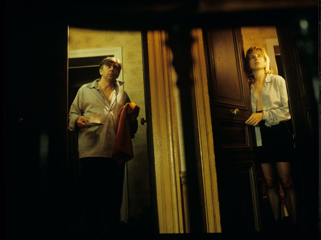 Lucille (Charlotte Very) and her neighbor are scheduled to meet at Lucille's apartment.