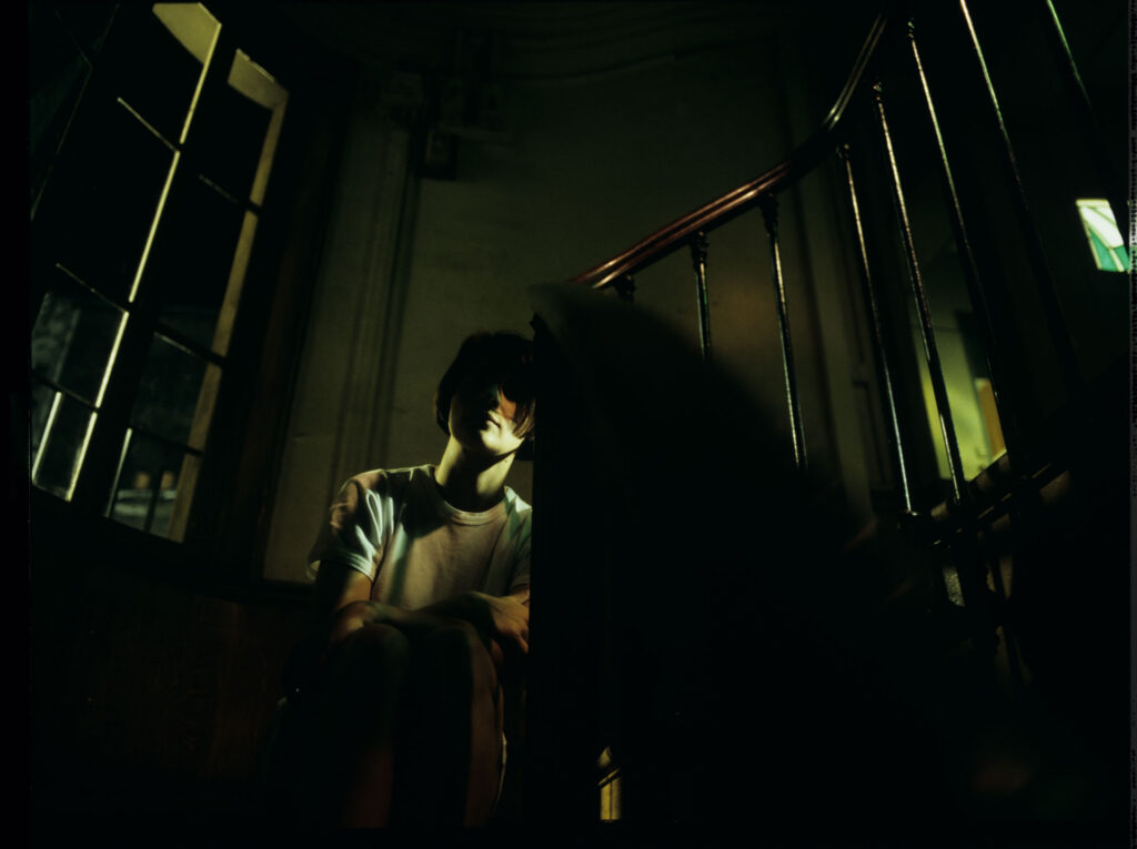 Julie (Juliette Binoche) spends the night in the stairwell.