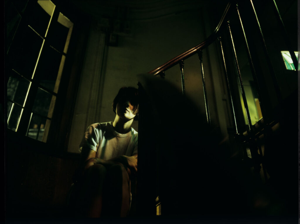 Julie (Juliette Binoche) spends the night in the stairwell.