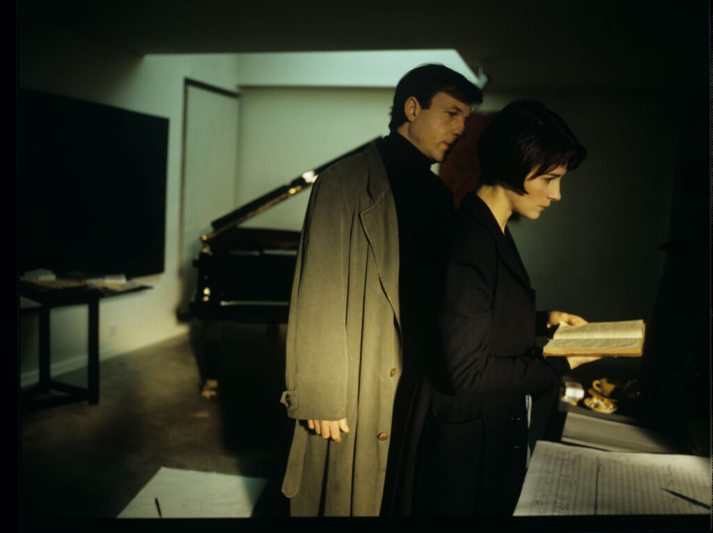 Julie (Juliette Binoche) and Olivier (Benoit Regent) working on finishing Patrice's, Julie's husband, composition.