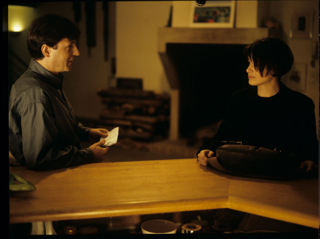 Julie (Juliette Binoche) and Olivier (Benoit Regent) working on finishing Patrice's, Julie's husband, composition.