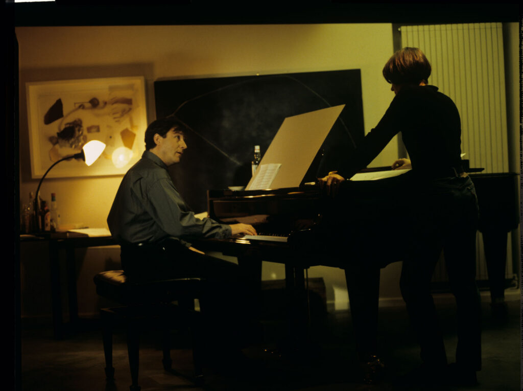 Julie (Juliette Binoche) and Olivier (Benoit Regent) working on finishing Patrice's, Julie's husband, composition.
