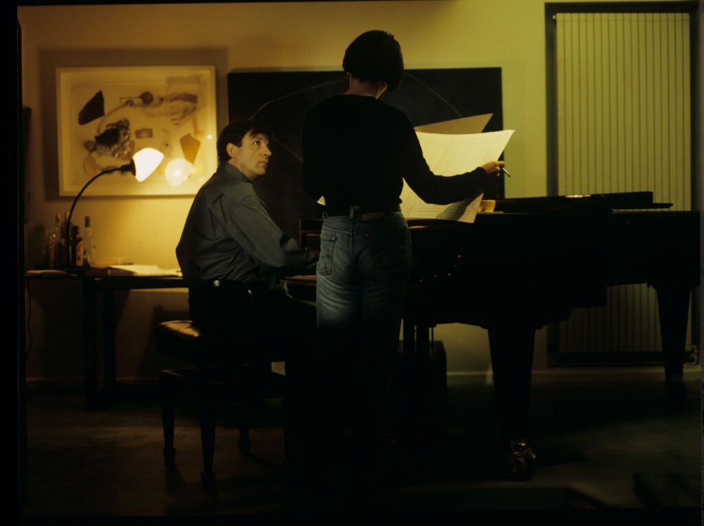 Julie (Juliette Binoche) and Olivier (Benoit Regent) working on finishing Patrice's, Julie's husband, composition.