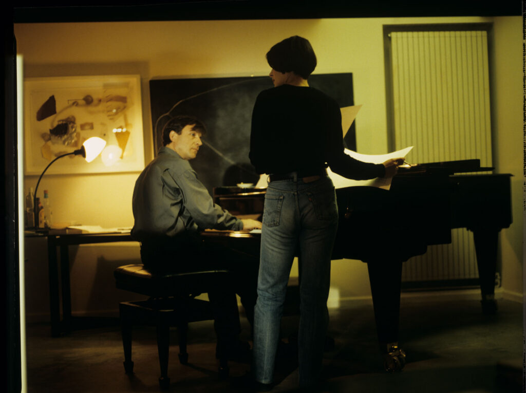 Julie (Juliette Binoche) and Olivier (Benoit Regent) working on finishing Patrice's, Julie's husband, composition.