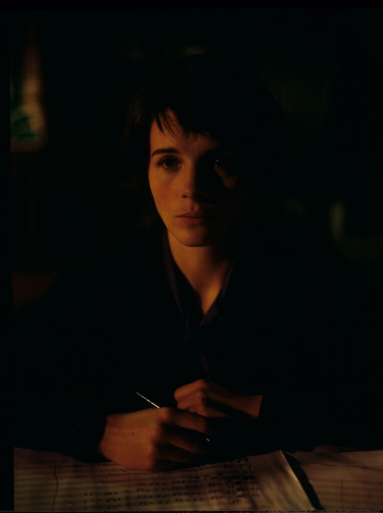Julie (Juliette Binoche) and Olivier (Benoit Regent) working on finishing Patrice's, Julie's husband, composition.