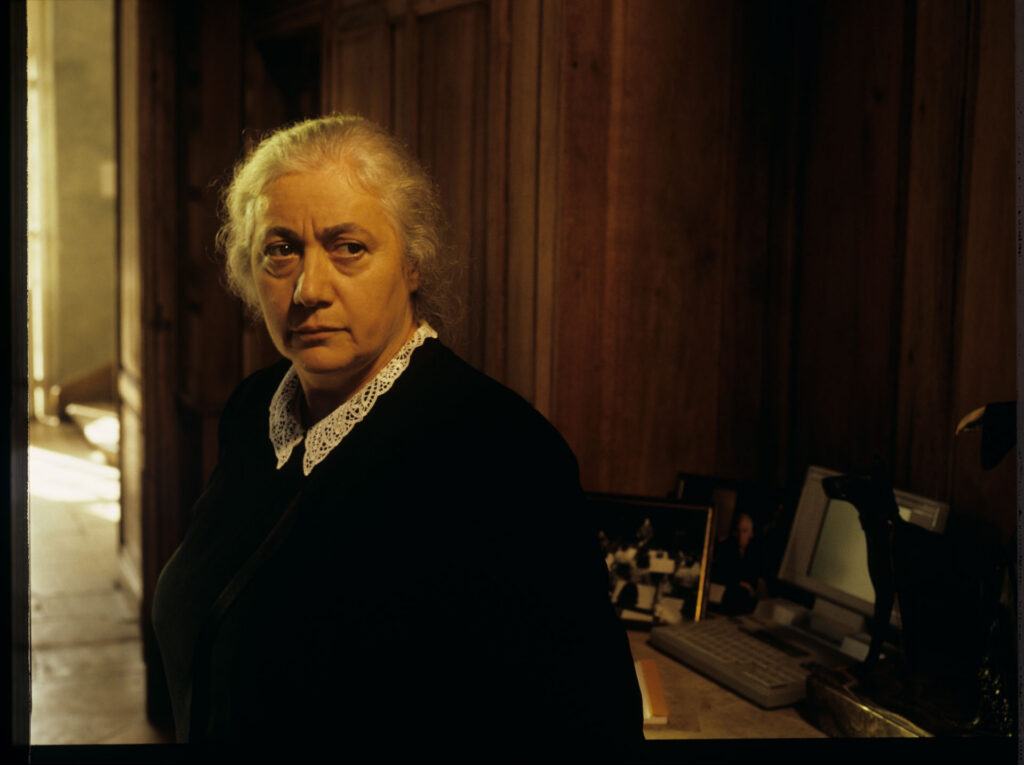 A maid (Isabelle Sadoyan) at the de Courcy estate watches Julie with concern.