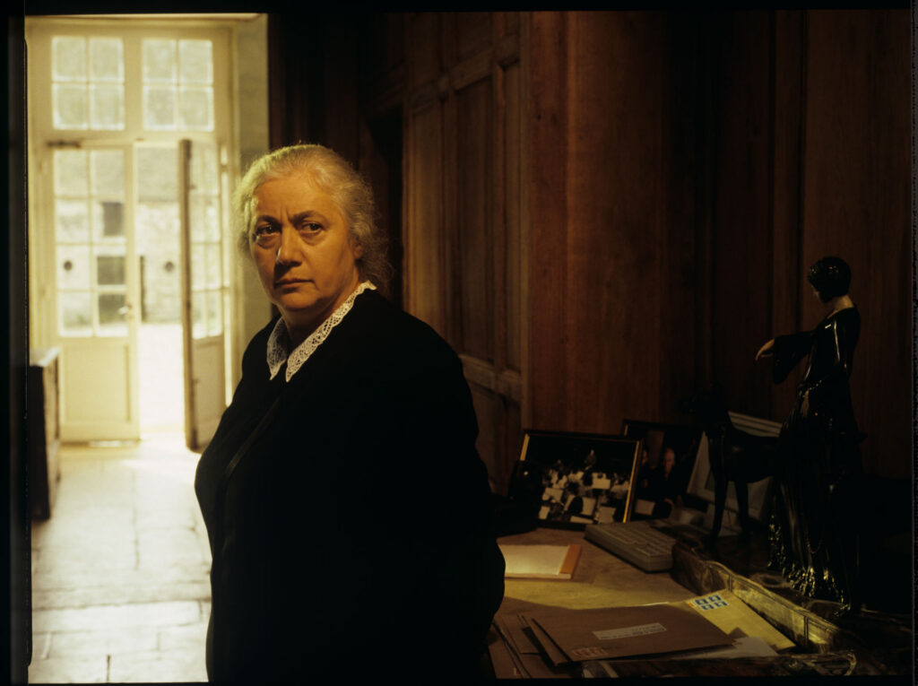 A maid (Isabelle Sadoyan) at the de Courcy estate watches Julie with concern.