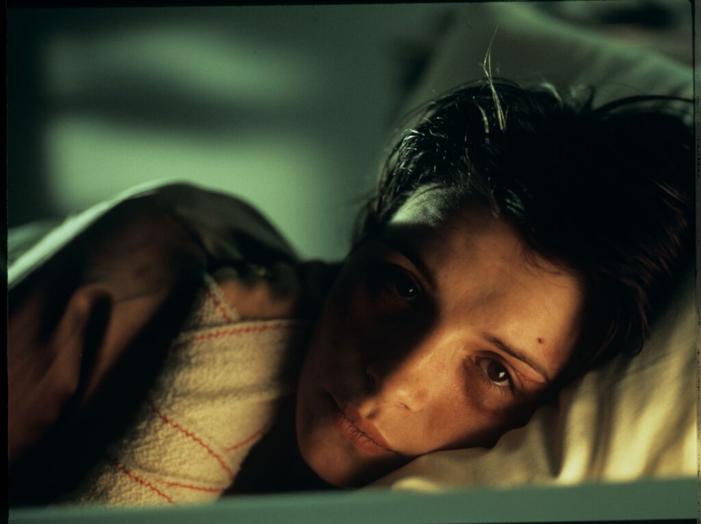 Julie (Juliette Binoche) in the hospital after a tragic car accident in which her husband and daughter were killed.