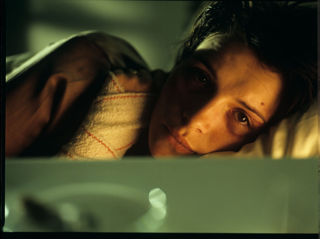 Julie (Juliette Binoche) in the hospital after a tragic car accident in which her husband and daughter were killed.