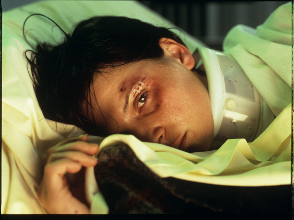 Julie (Juliette Binoche) in the hospital after a tragic car accident in which her husband and daughter were killed.