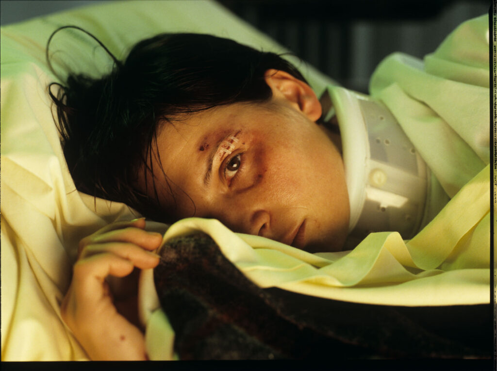 Julie (Juliette Binoche) in the hospital after a tragic car accident in which her husband and daughter were killed.