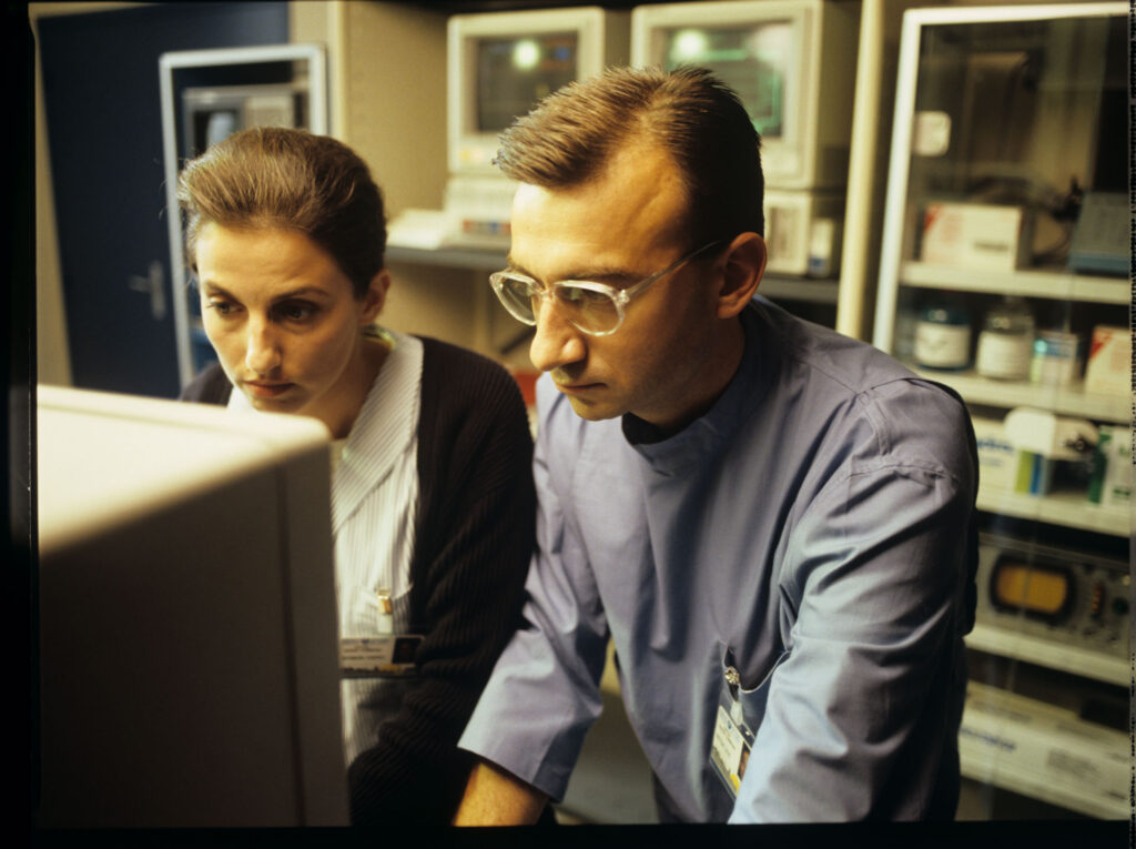 A doctor and a nurse (Idit Cebula) monitor a patient's vital signs in the hospital.