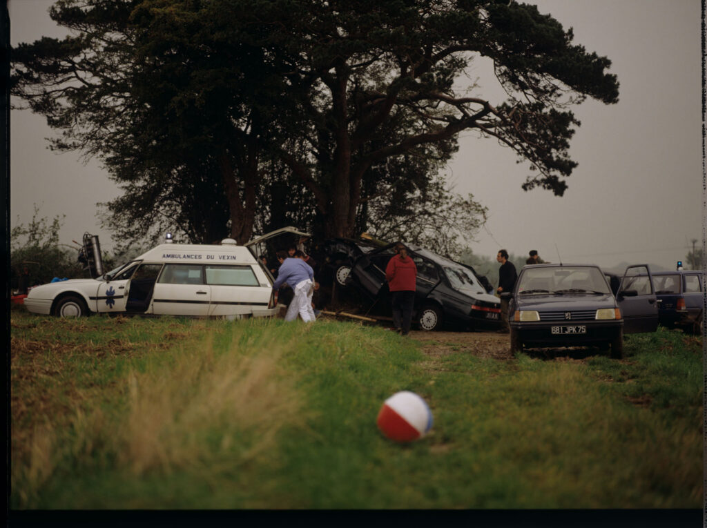 Filming the scene of the rescue team arrival in a car accident.
