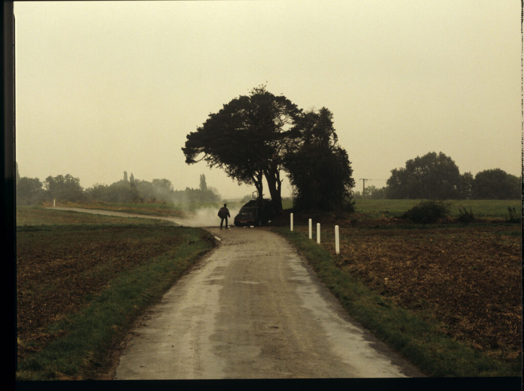 Patrice's, Julie's husband, crashed car right after the accident. Antoine (Yann Tregouett) arrives at the scene of the event