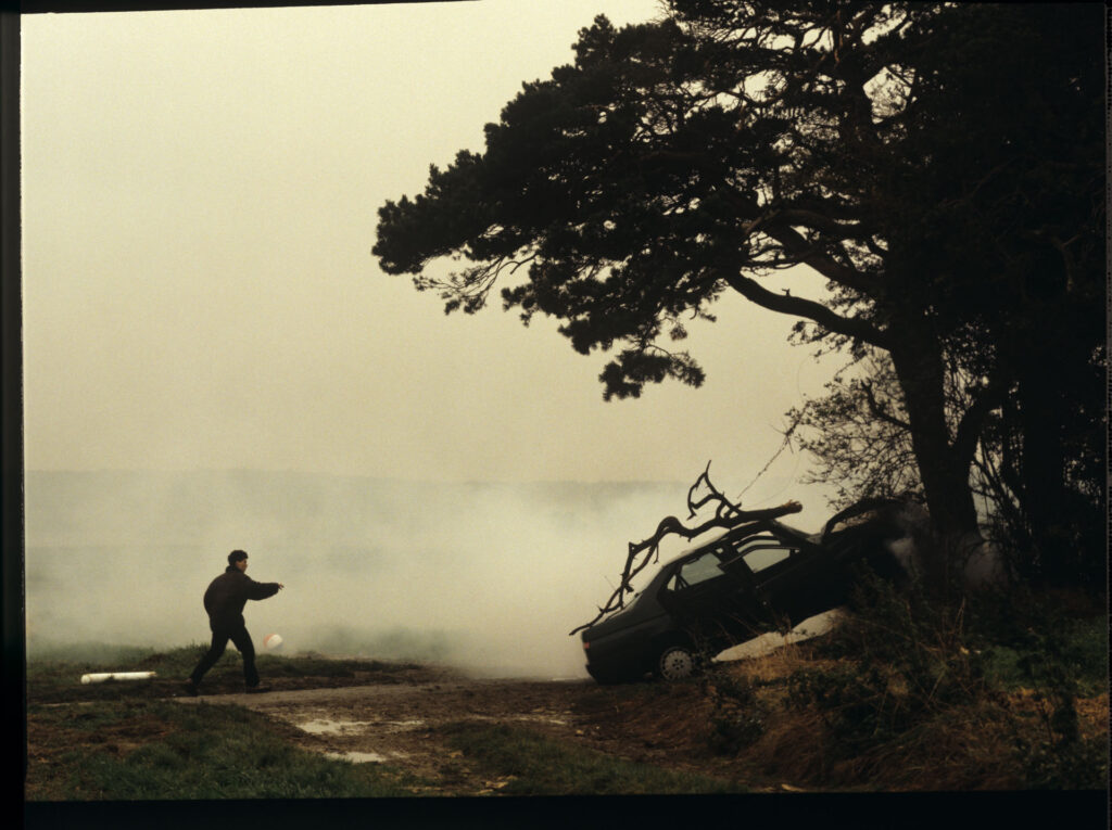 Patrice's, Julie's husband, crashed car right after the accident. Antoine (Yann Tregouett) arrives at the scene of the event