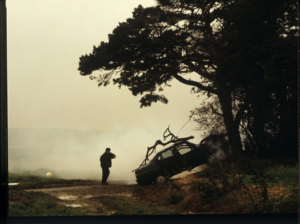Patrice's, Julie's husband, crashed car right after the accident. Antoine (Yann Tregouett) arrives at the scene of the event