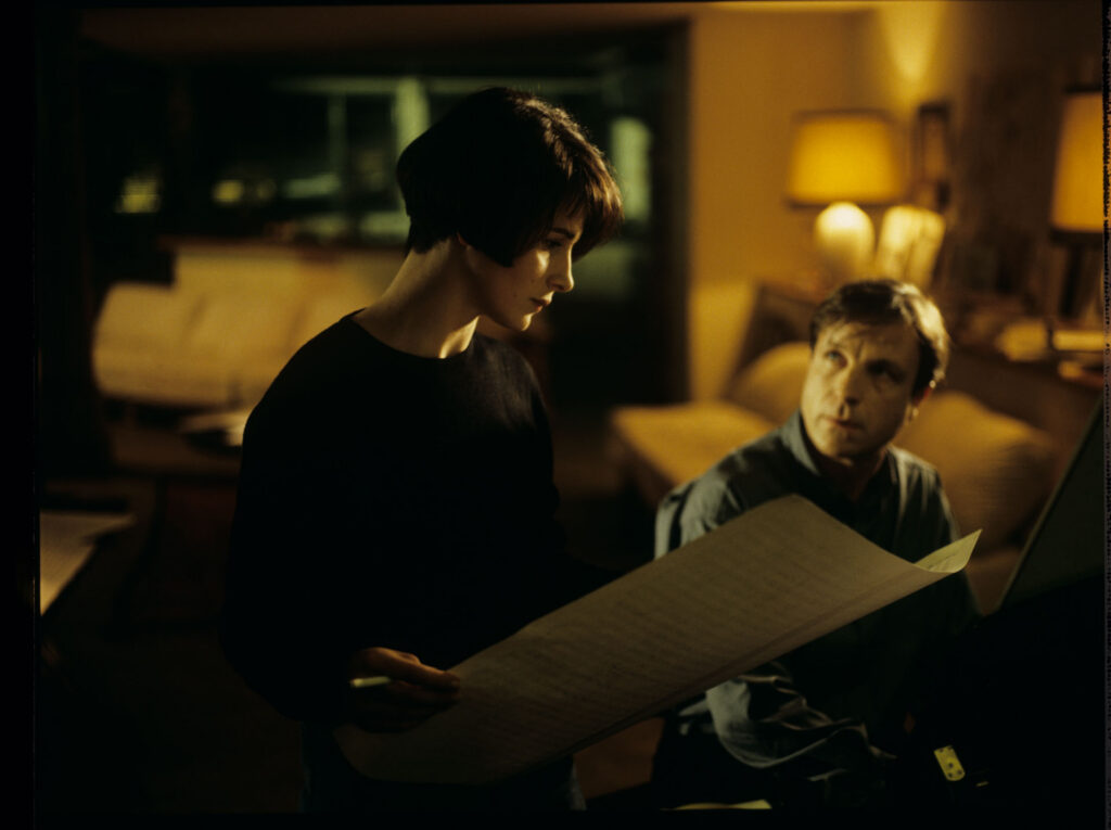 Olivier (Benoit Regent) and Julie (Juliette Binoche) while working on the completion of oratorio.