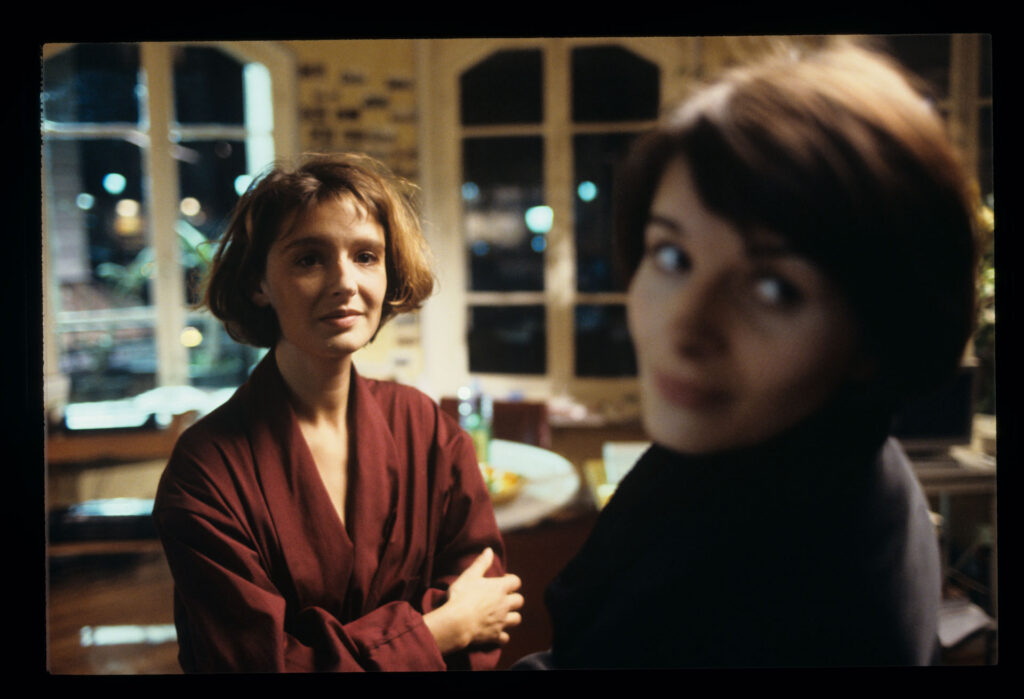 A copyist (Florence Vignon) in her apartment during a visit from Julie (Juliette Binoche).