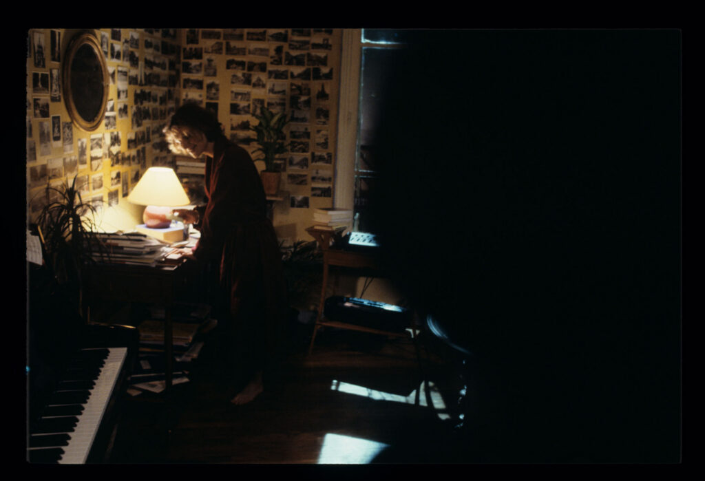 A copyist (Florence Vignon) in her apartment during a visit from Julie (Juliette Binoche).