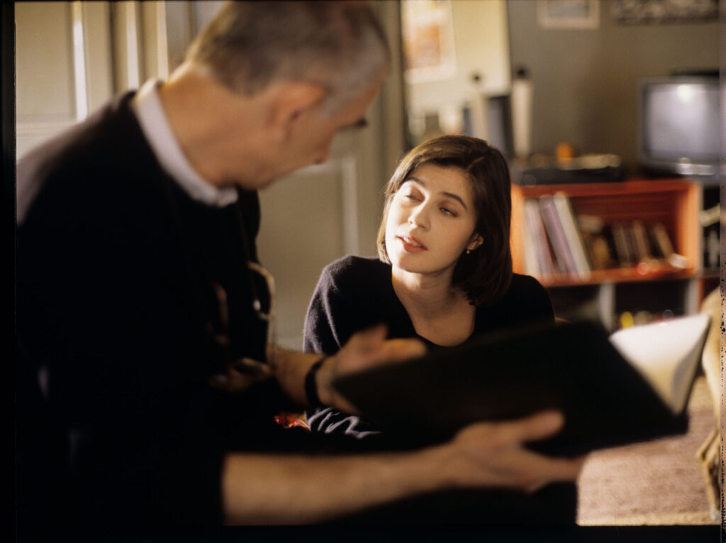 Krzysztof Kieślowski (director) and Irène Jacob (playing Valentine) during a break between takes.