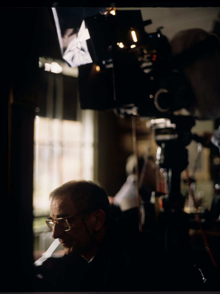 Krzysztof Kieślowski (director) on the set in the judge's apartment.