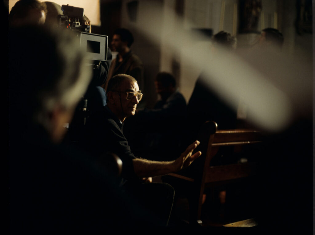 Krzysztof Kieślowski (director) on the set in the judge's apartment.