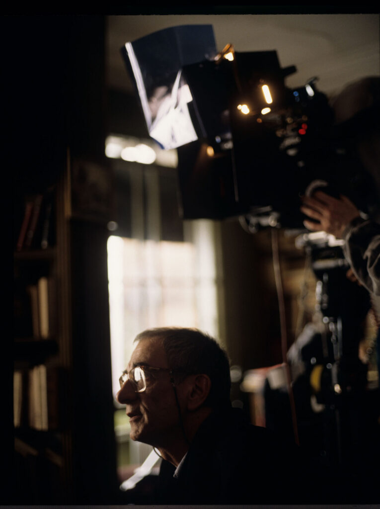 Krzysztof Kieślowski (director) on the set in the judge's apartment.