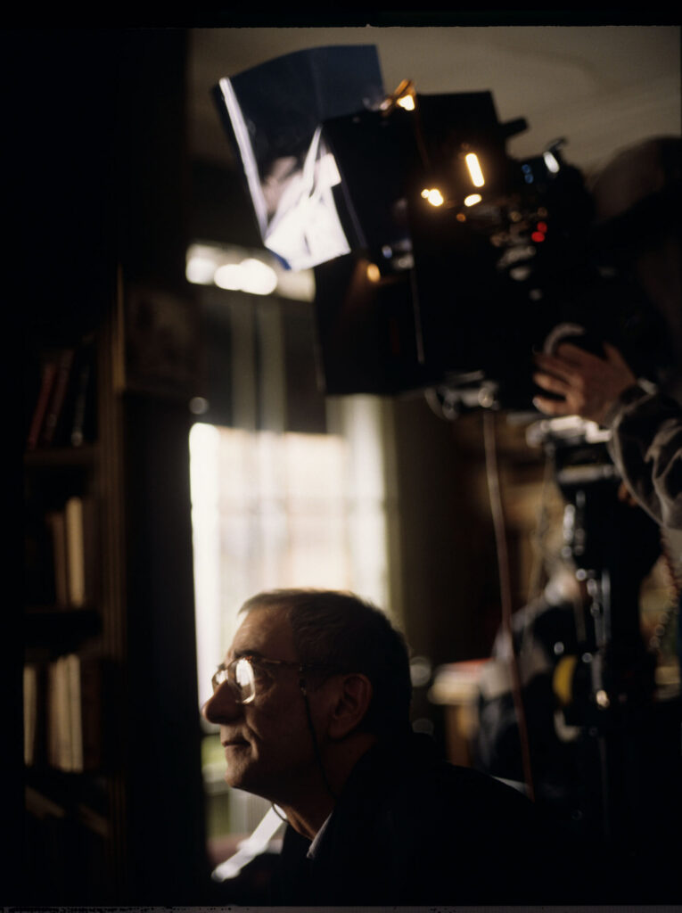 Krzysztof Kieślowski (director) on the set in the judge's apartment.