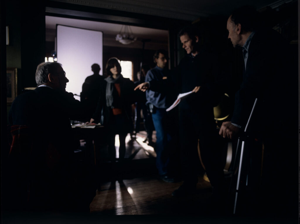 Film crew on set in the judge's apartment.