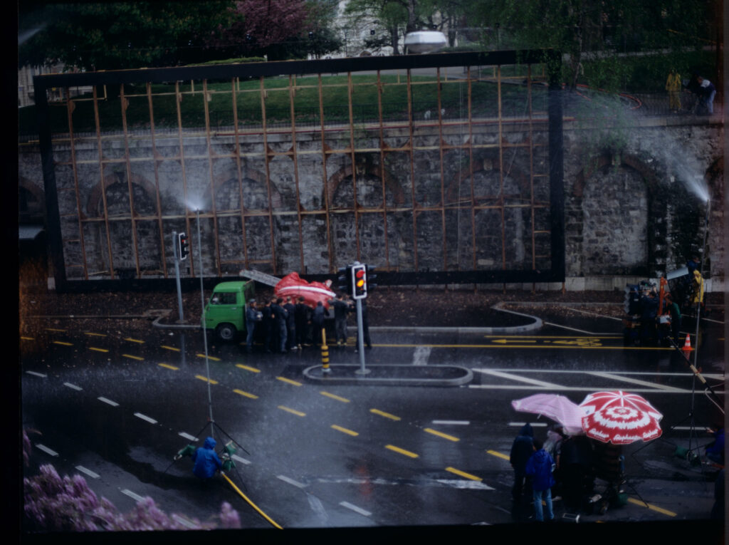The film crew assembling an advertising billboard with the image of Valentine - the main character of the film.