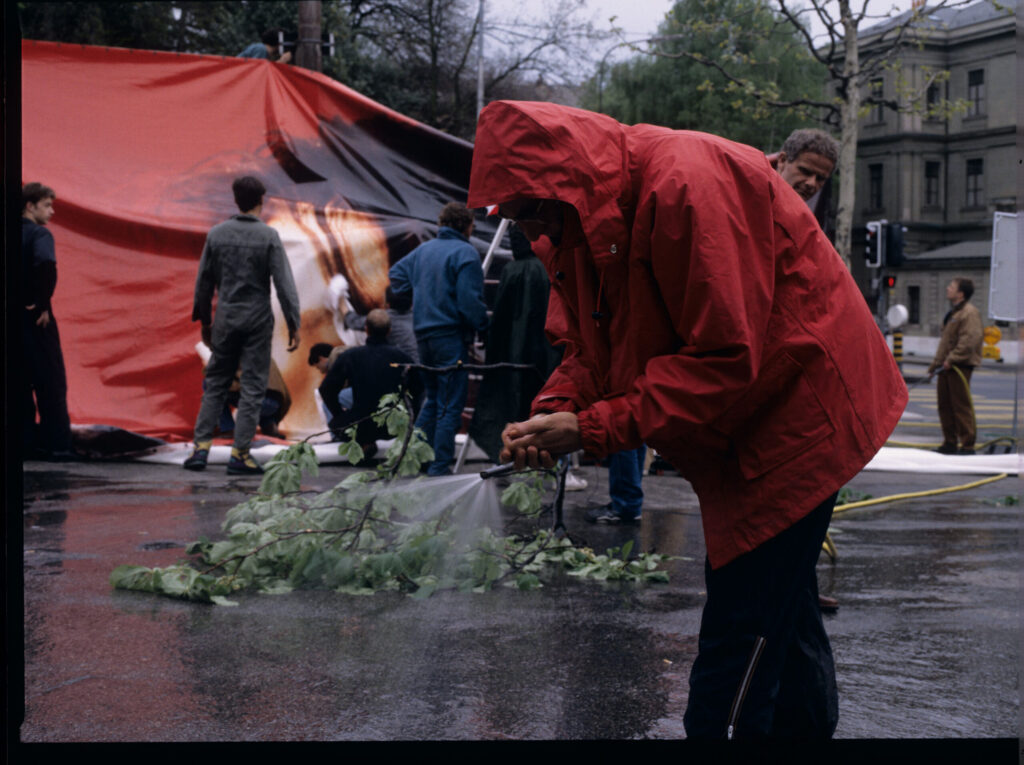 Filming the scene of the dismantling of an advertising billboard during a storm over Geneva.