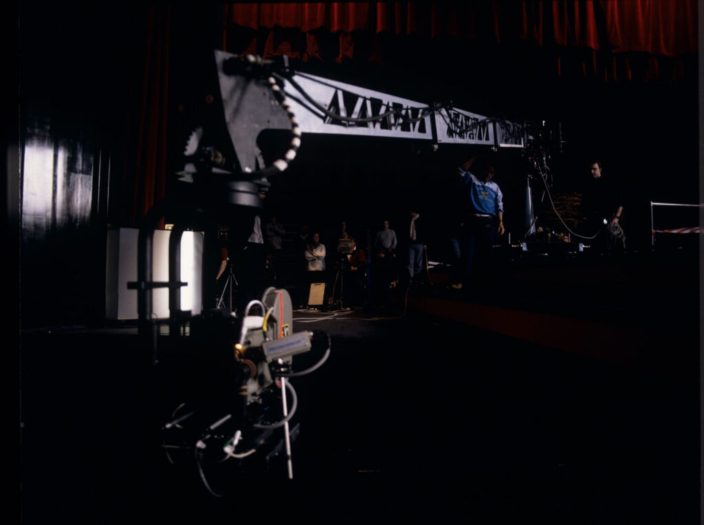 The crew preparing to shoot a fashion show scene in the theater.