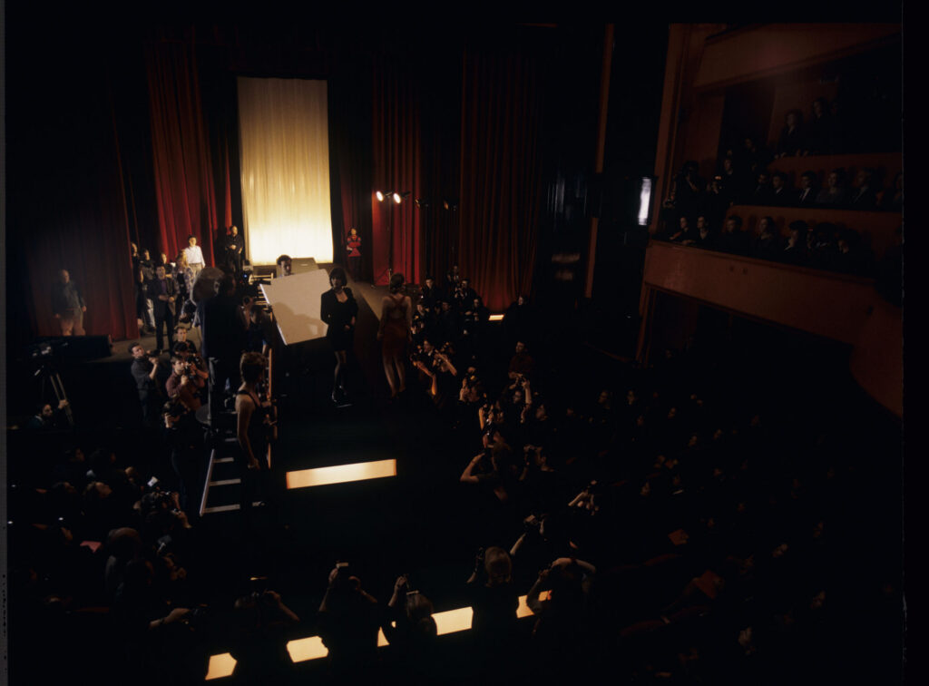 Filming a fashion show scene at the theater featuring Valentine. Actress Irène Jacob as Valentine on the set.