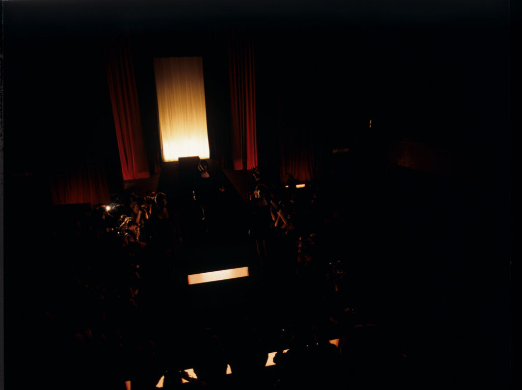 Filming a fashion show scene at the theater featuring Valentine. Actress Irène Jacob as Valentine on the set.