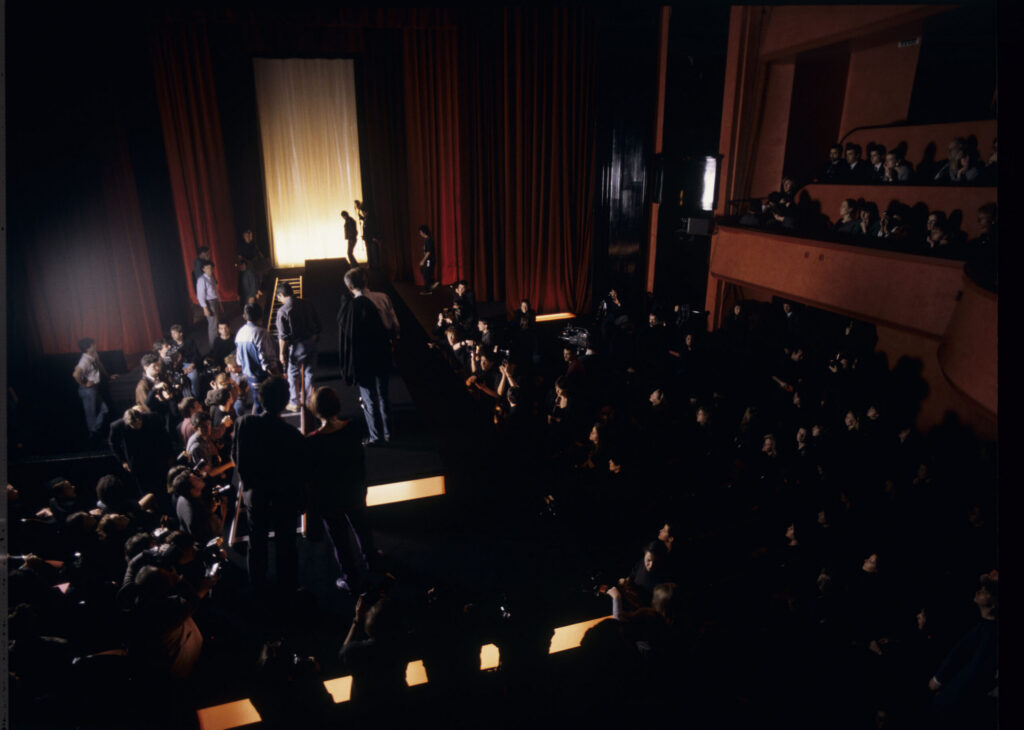 Filming a fashion show scene at the theater featuring Valentine. Actress Irène Jacob as Valentine on the set.