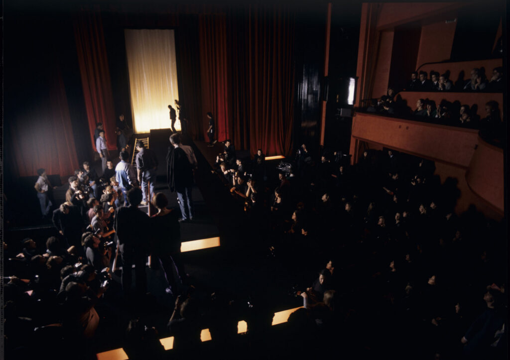 Filming a fashion show scene at the theater featuring Valentine. Actress Irène Jacob as Valentine on the set.