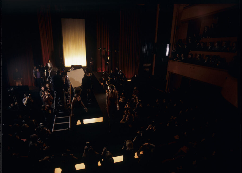 Filming a fashion show scene at the theater featuring Valentine. Actress Irène Jacob as Valentine on the set.