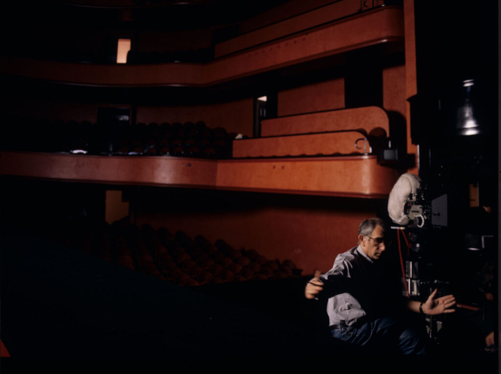 Kieślowski (director) on the set in the theater during the filming of the meeting scene between Valentine and the judge.