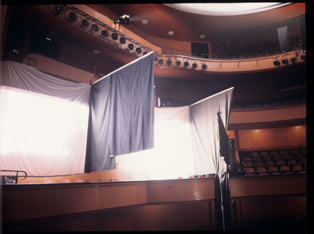 Preparing the theatre audience for filming.